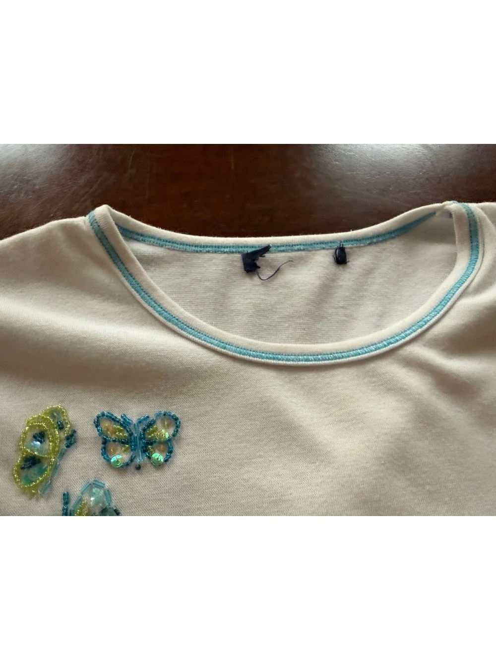 White Sleeveless Top with Beaded Butterfly Embellishments